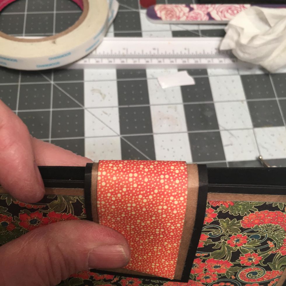 The is the curve that you want on the closure piece. Gently curve it so as to not crack your patterned paper.