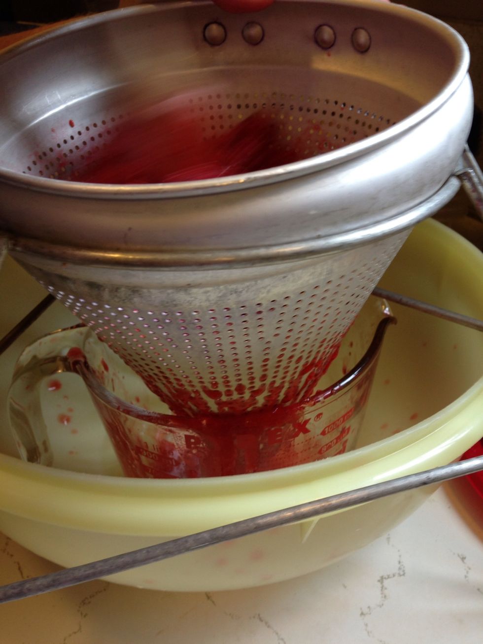 The juice will funnel into the measuring cup. You need 2 cups of mashed fruit and juice.