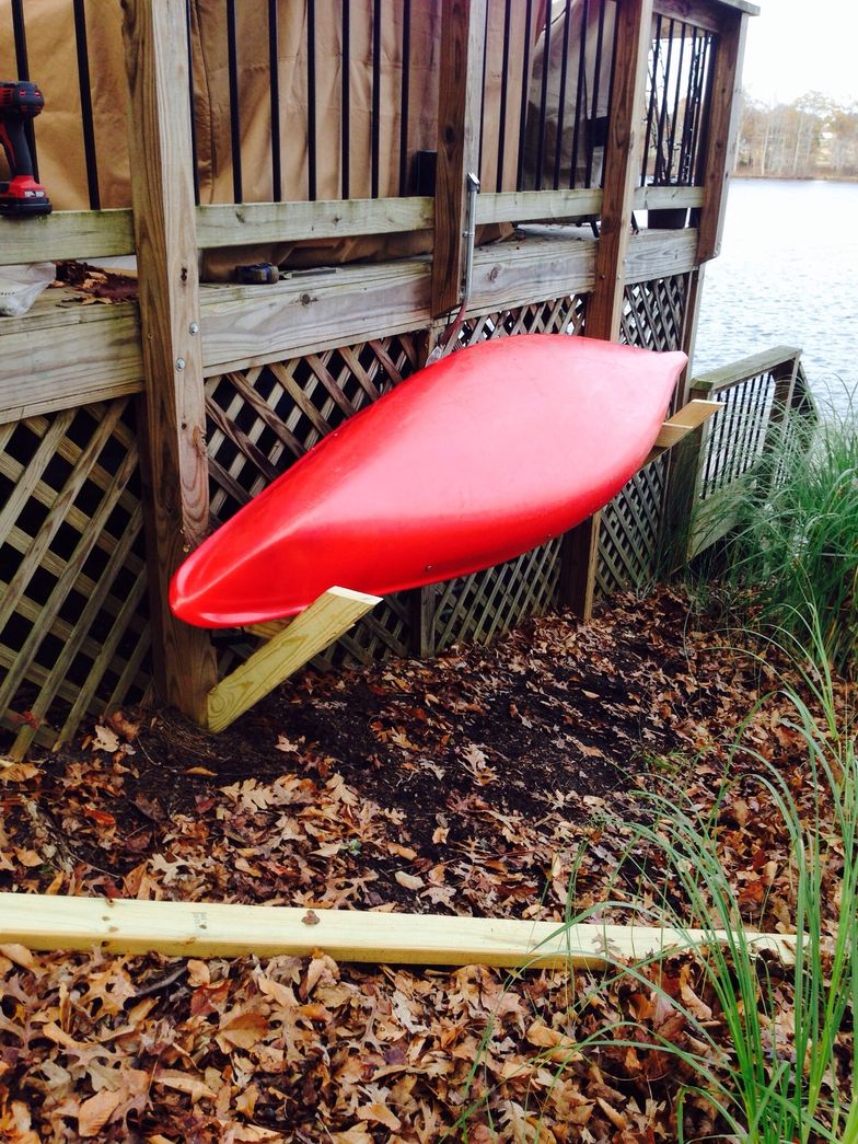 DIY kayak rack - easy to build in a couple hours. Built with 9 - 2x4s and a  box of screws.