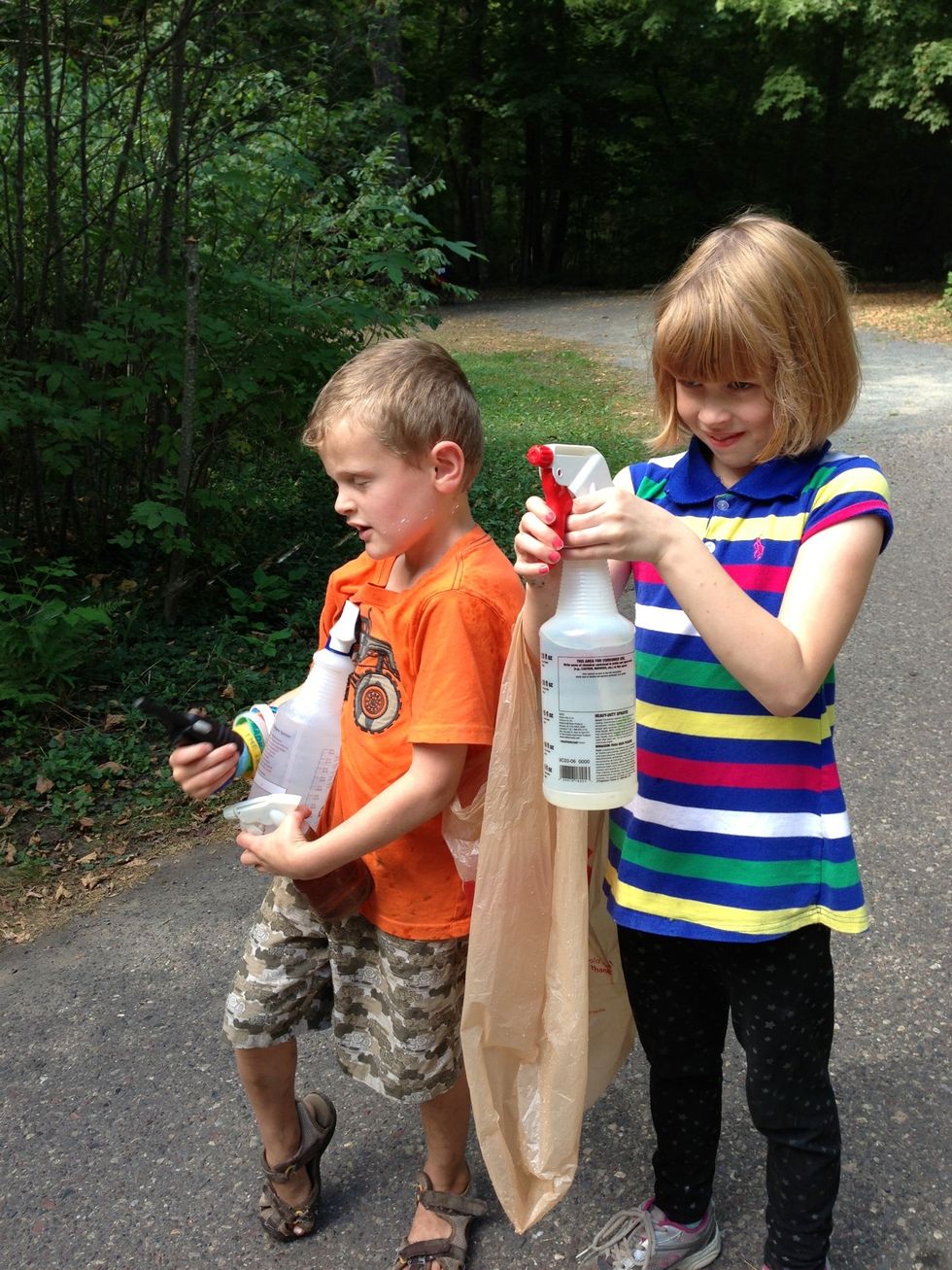 The kids found a place to fill the squirt bottles and even a chance to squirt each other before we added paint to each. .