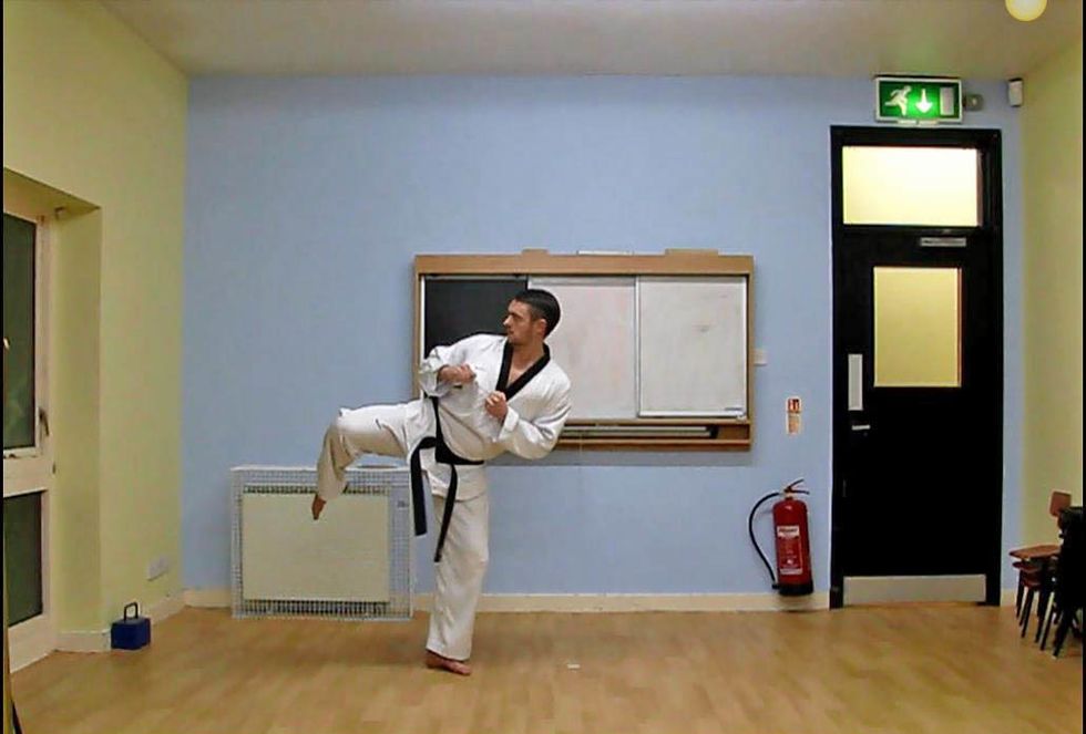 The Knee comes up and the standing foot pivots 180 degrees to the outside so that the heel is now facing the target. This naturally causes the hips, shoulders and body to flip across.