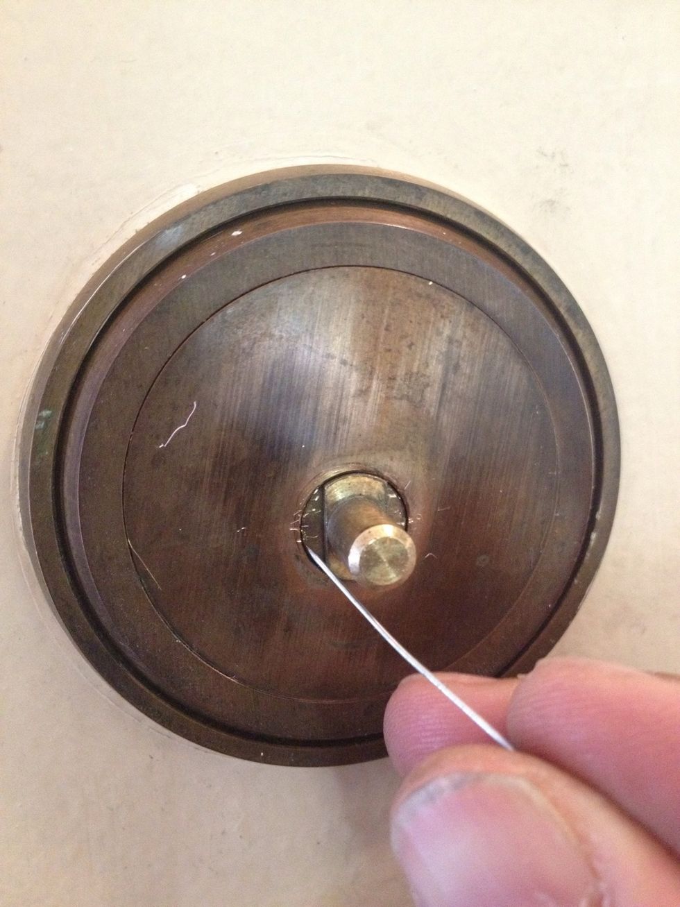 The knob should pull off easily. If not loosen the screw some more. The plate around the shaft covers the screws. Use a pin to pry it off.