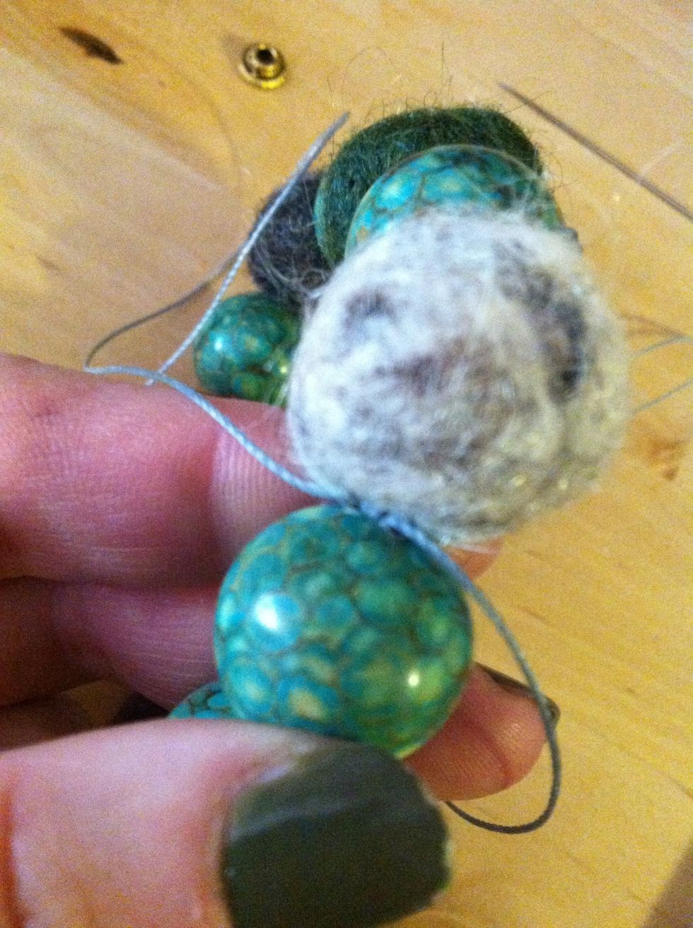 The knot nestles between the beads.