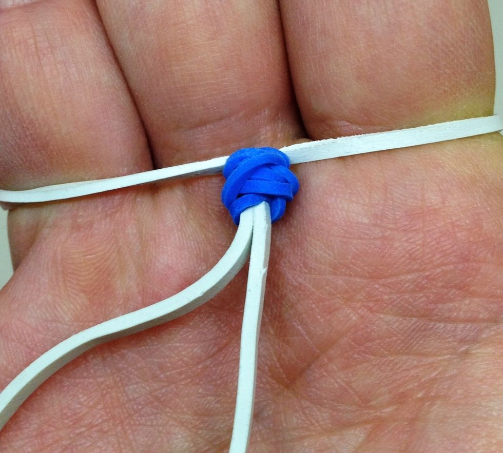 The last band goes on your hand and you can use 2 small rubber bands or even a bead to ensure a firm fit. The other end attaches to the swivel and you are done!