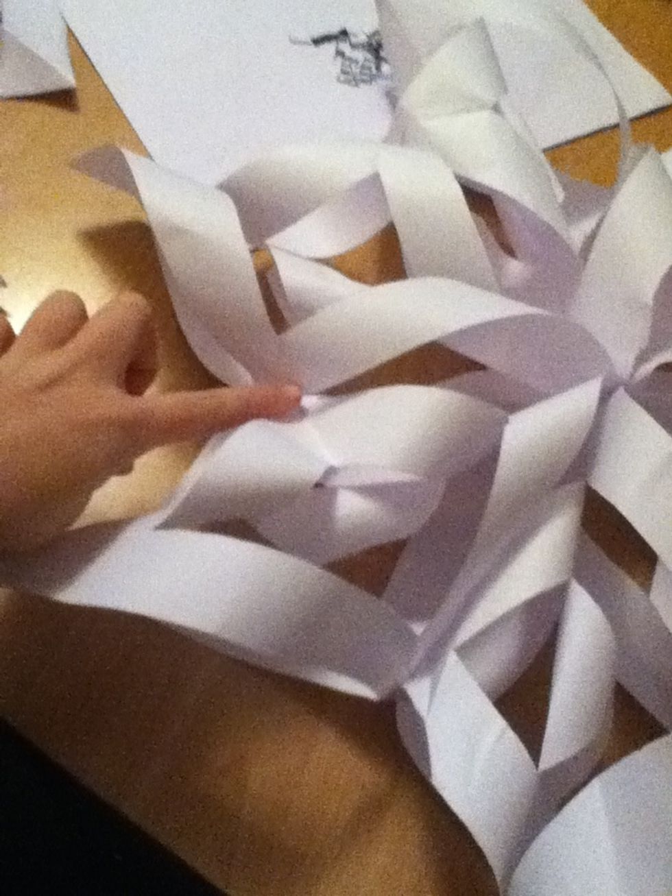The last step is to staple them together all the way round where my finger is to give it support