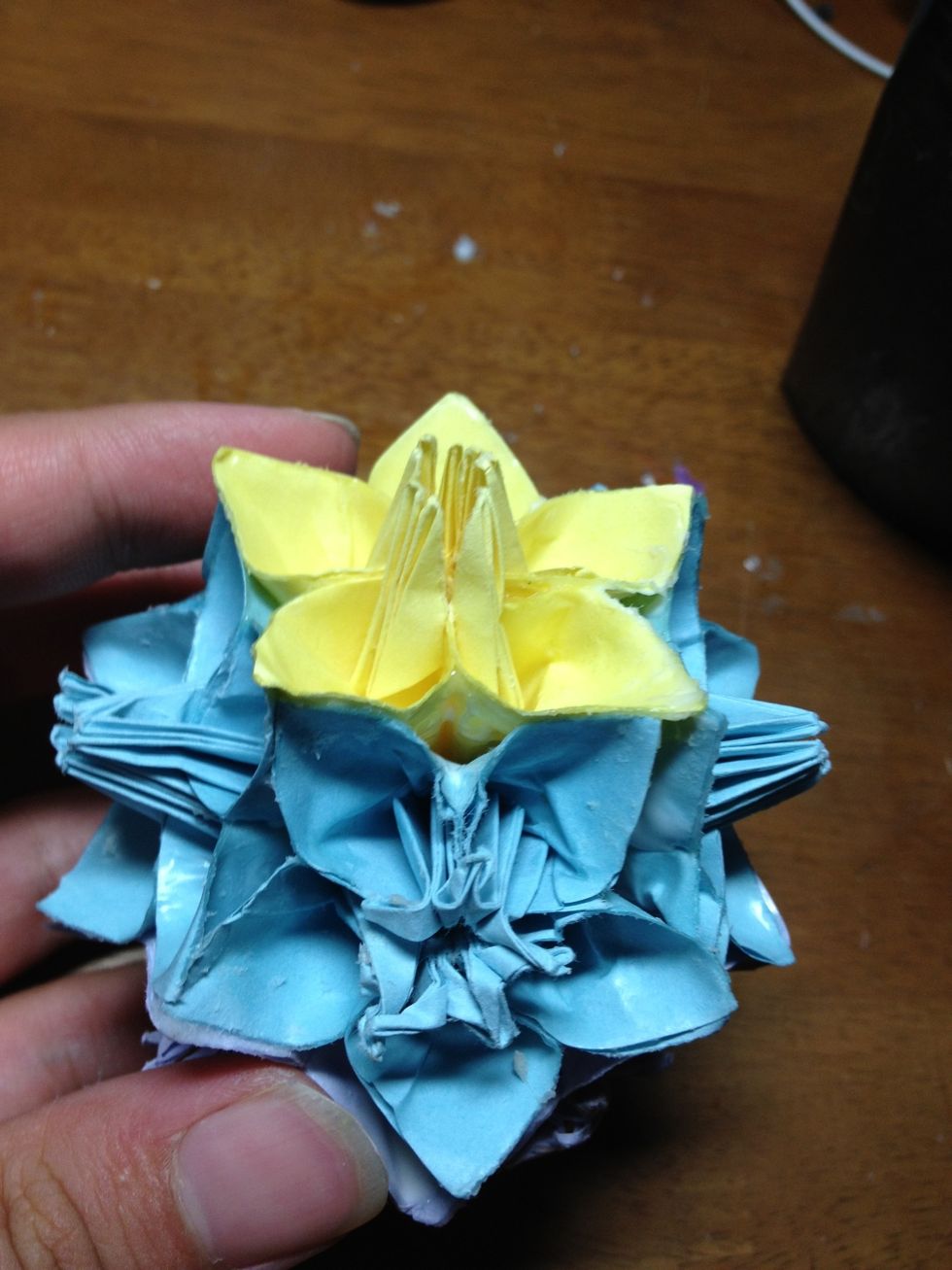 The last thing, and this is optional, is to take the insides of the each flower (middle parts standing up on the yellow flower), and twist them in or out (whichever you want), and make more pretty.