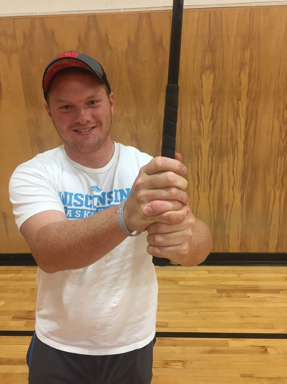 The left pointer finger goes between the right pinky and ring finger to crest the interlock grip