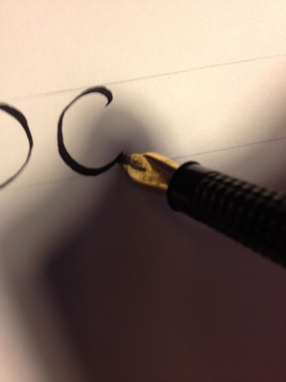 The letter "c is even simpler: maintaining that 45 degree angle, make a small upward tic, then make a semicircle.