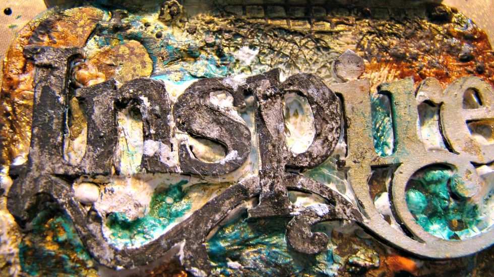 The letters I painted a coat of black gesso, and while still wet, using a baby wipe I dabbed off some to soften the intensity.