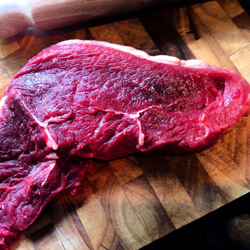 The lines of fat in the meat are a great asset for rump steak, they will stop the meat being chewy and dry. A large cut will cook more evenly than two separate pieces.