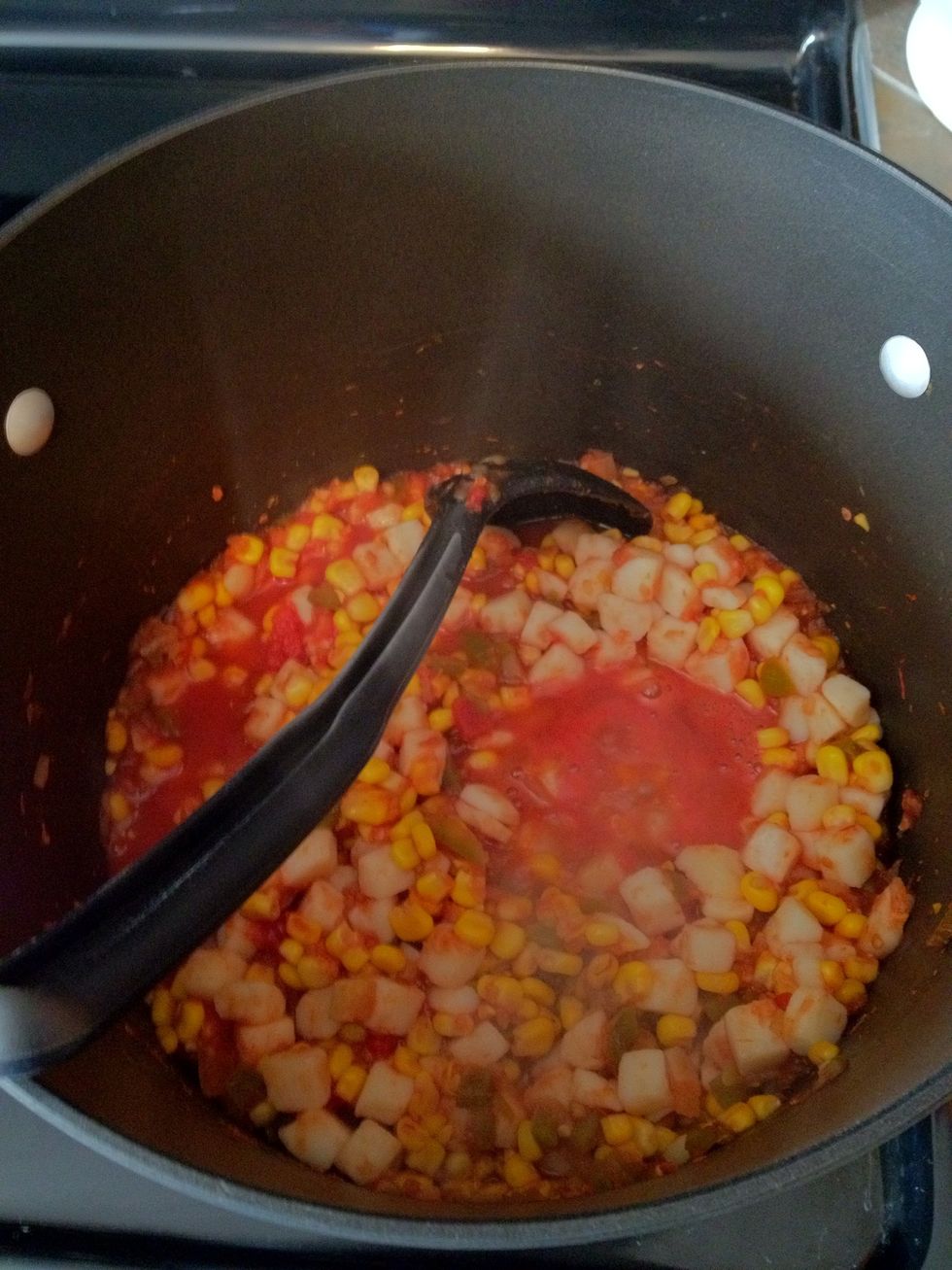 The little simmering pools are where you will get the most evaporation. Also, once it all gets hot enough, rapid (but controlled) stirring will speed up the evaporation as well.