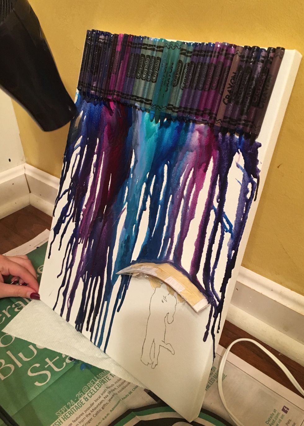 The longer you melt them, the more there will be across the canvas. If its taped it down right, the crayon should go around or sit on top of the flashcard. Don't worry, this is the effect you want.