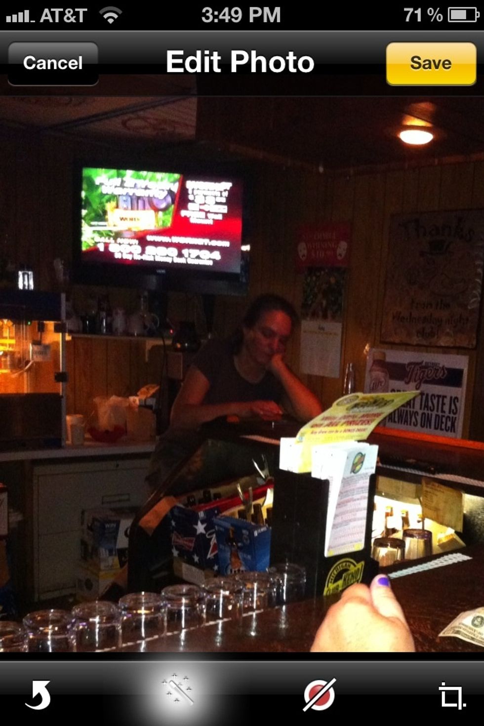 The magic wand is the auto enhance. Tap it to enhance the photo.