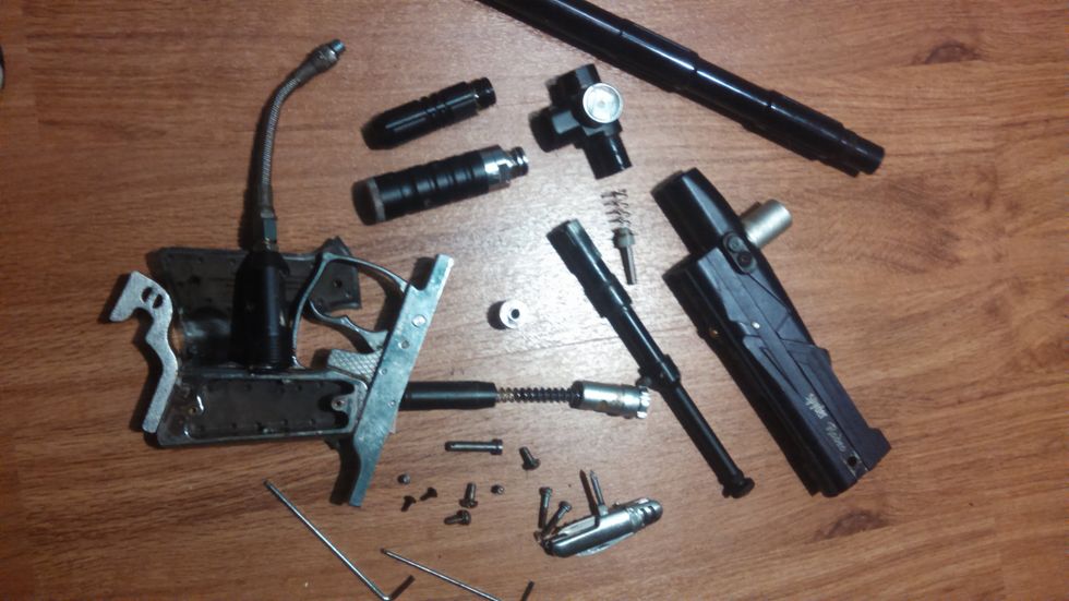 The marker completely broken down with all the screws and parts involved. Now that it is apart to rebuild simply follow the steps in reverse order. Double check all parts are cleaned and o-rings lubed