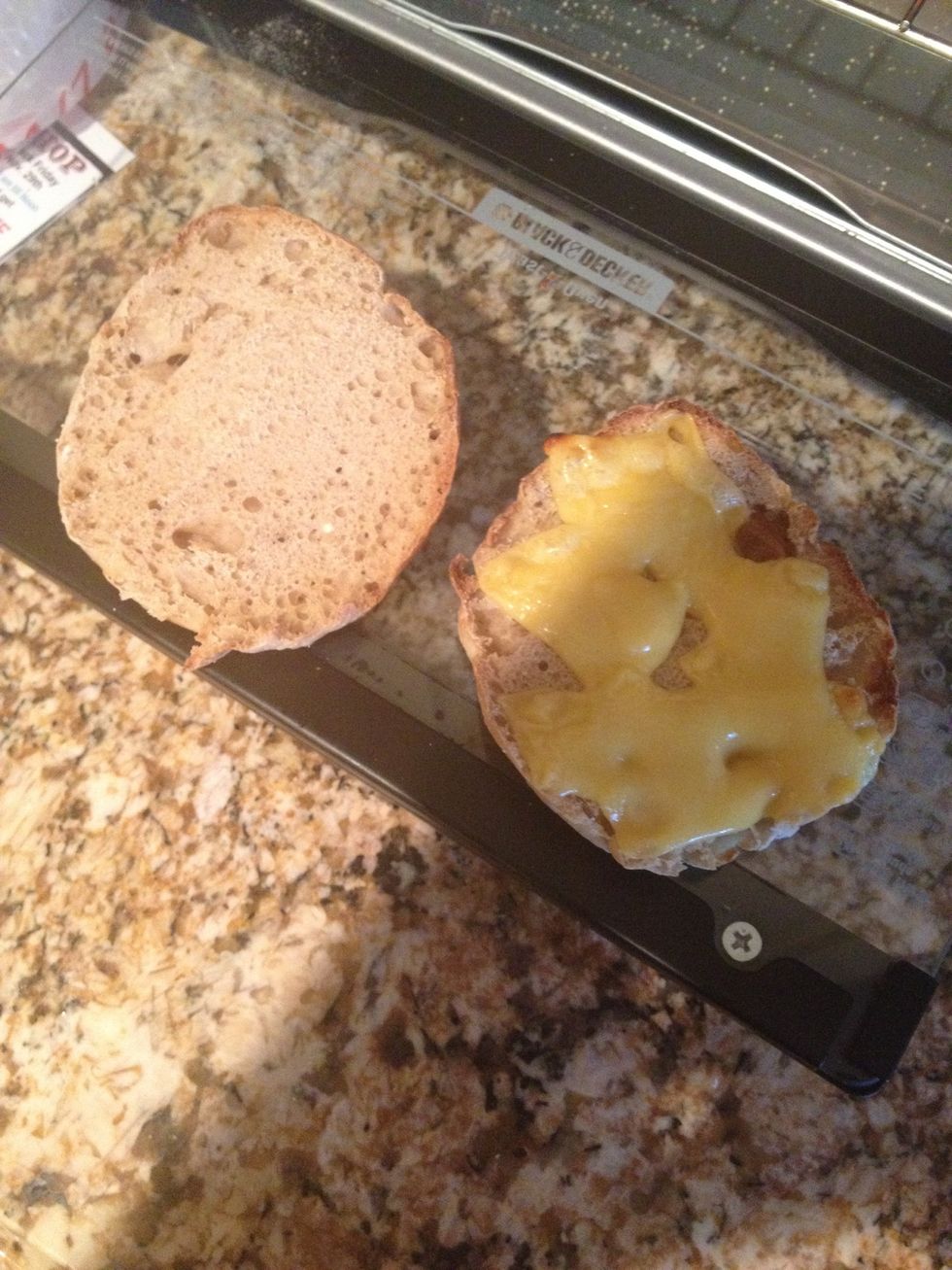 The melted cheese on the English muffin