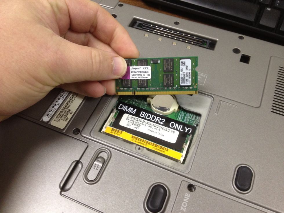 The memory module has one or more slots cut into the bottom of it.  Make sure that you align these slots, properly with the memory module port.  Insert the memory module at a 30 to 45\u00b0 angle
