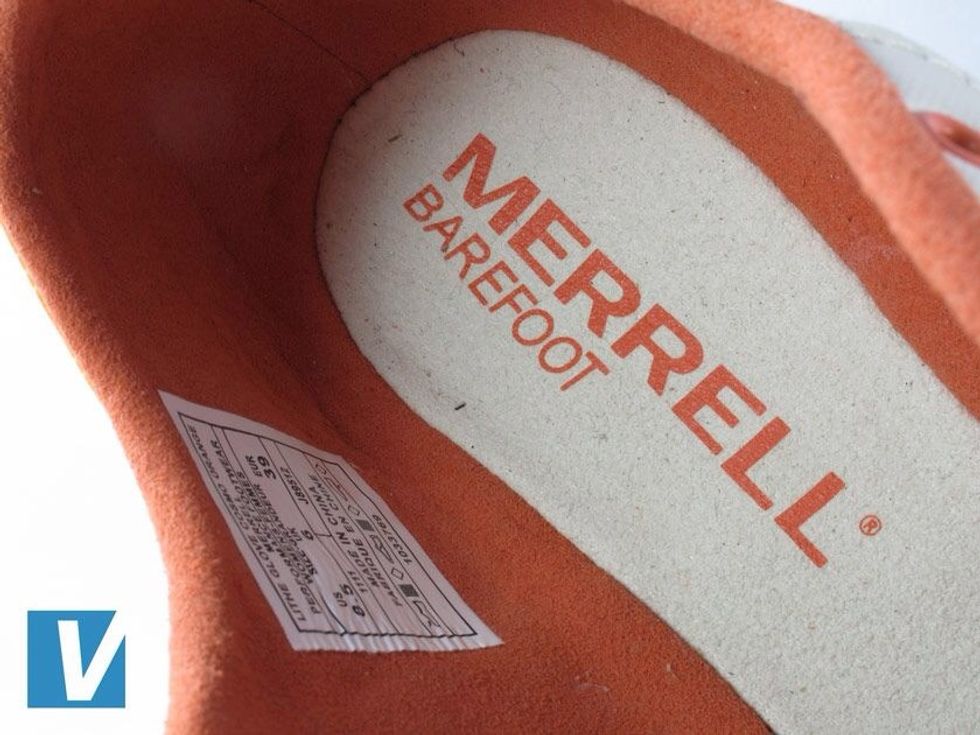 The Merrell logo can be found on the insole. It may have worn away on some used shoes but check that the registered trademark R is present.