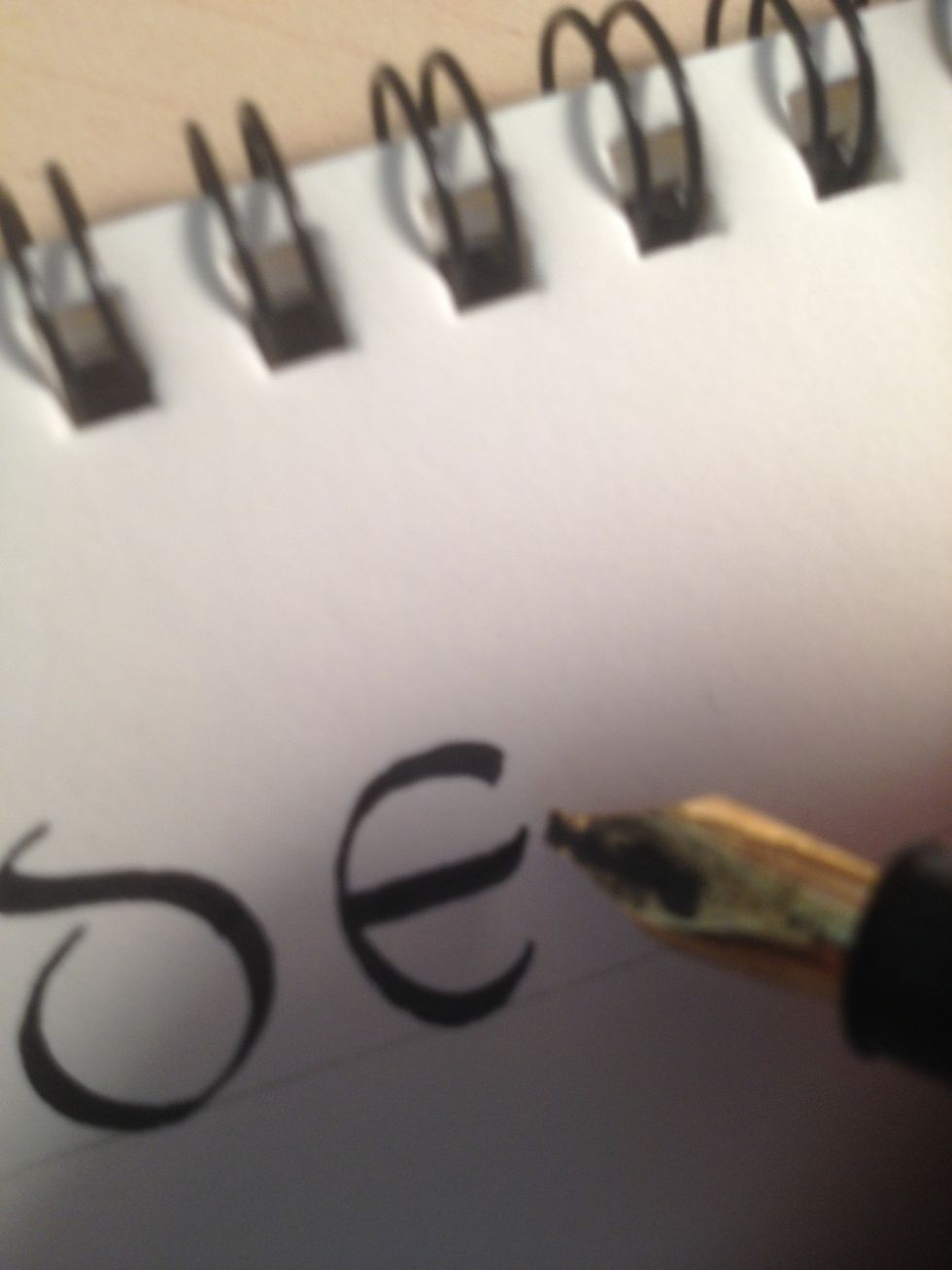 The middle bar should curve upwards at the end, and be slightly longer than the top and bottom bars.