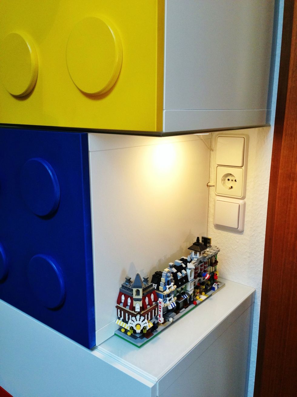 The mini modulars next to the switches. The lower switch turns on the lights in the display areas.