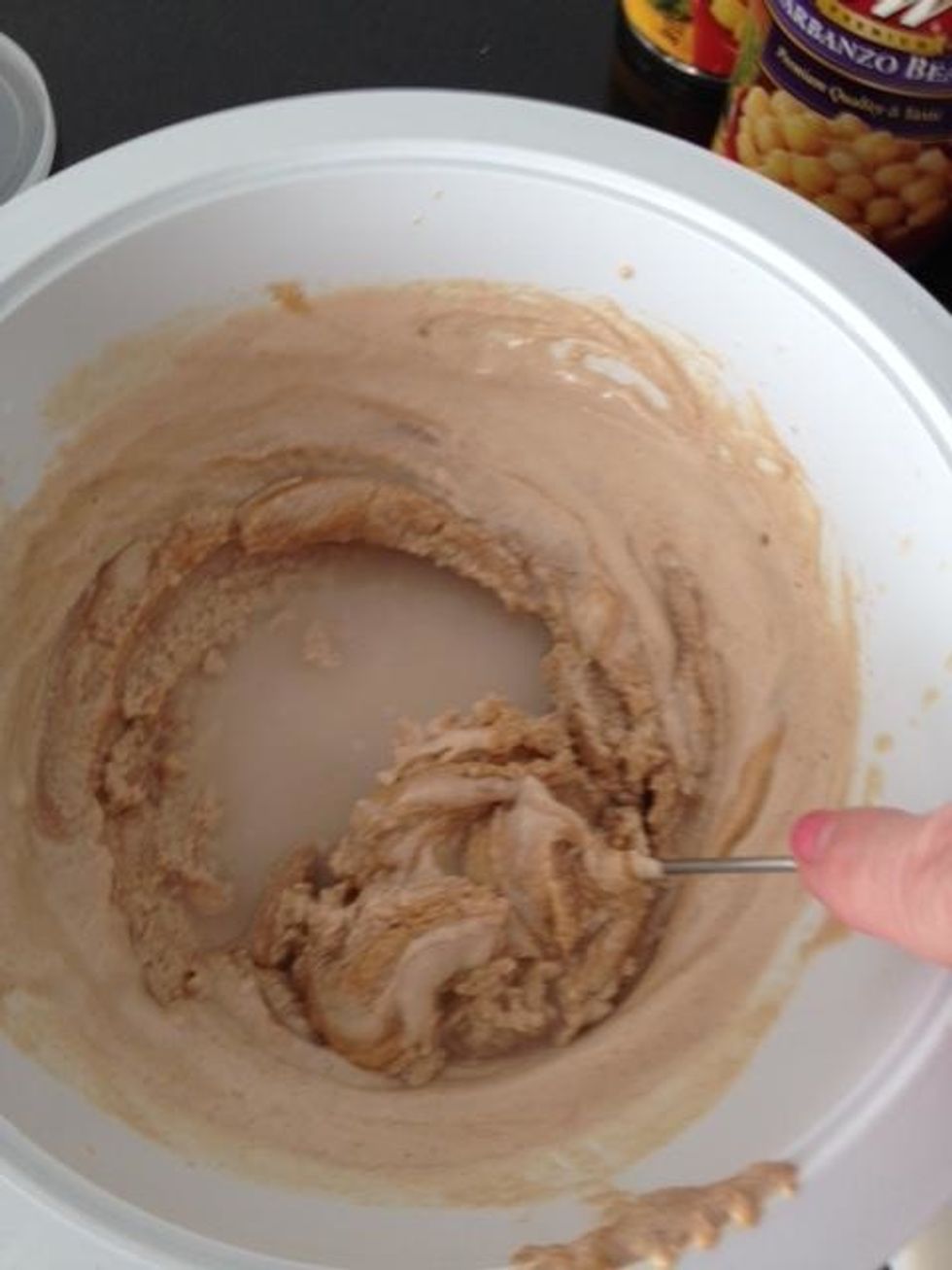 The mix goes hard at first. Keep adding liquids, and seasonings till you reach the taste and consistency you like. This'll take about 10 minutes. You want the consistency of bottled ketchup.