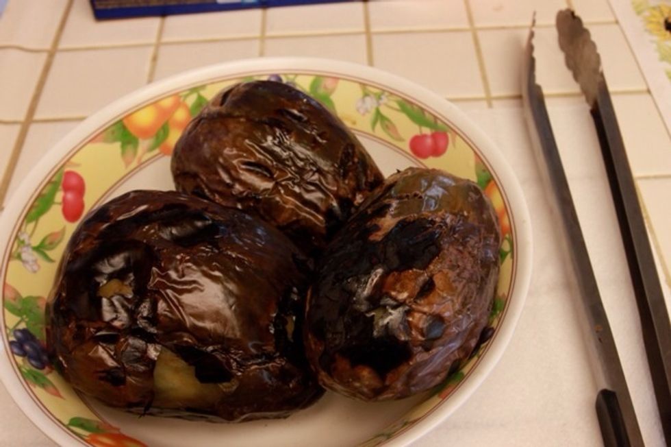 The more burnt/blackened the skin of the eggplant is, the easier it'll be to peel off.