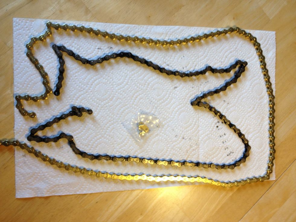 The new chain needs to be trimmed to fit your bike. Inspect the old chain to find the right length. I count links because the old chain has likely "stretched" a bit which makes measuring less precise.