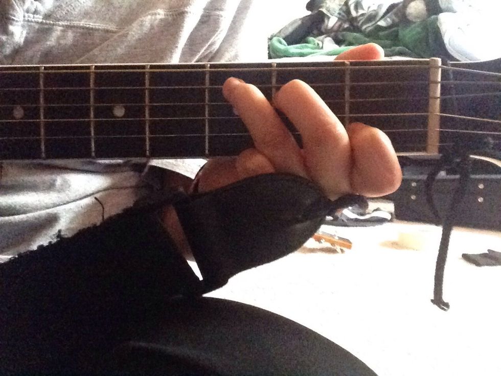 The next chord is labeled as C. It also takes three fingers to play the chord.