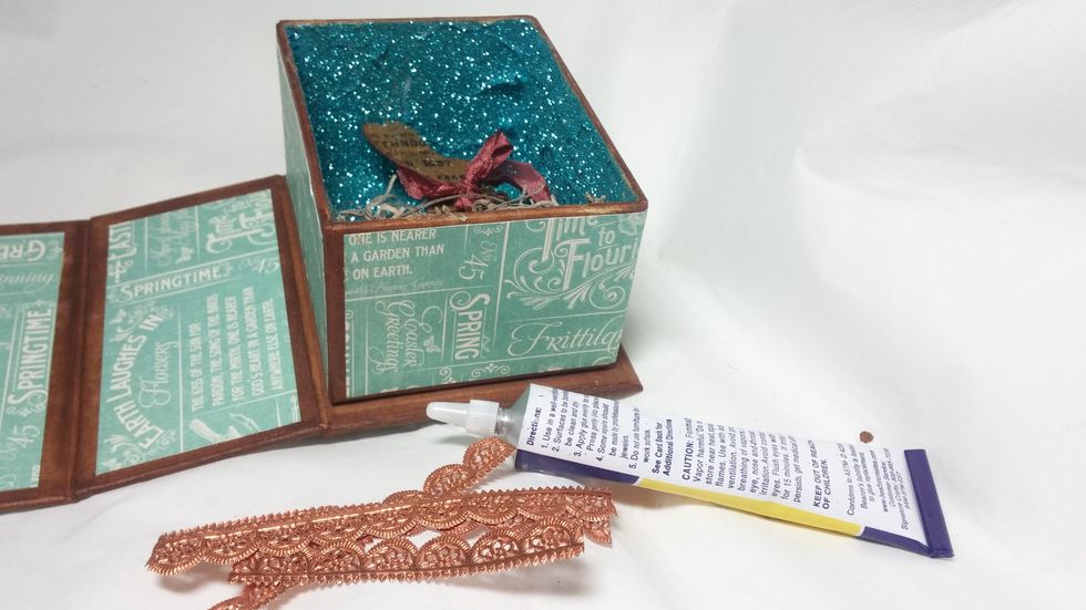 The next element is the Dresen border that I added around the edge. Tip: Be sure you are done decorating on inside before gluing this in! I learned this the hard way...it gets in the way!