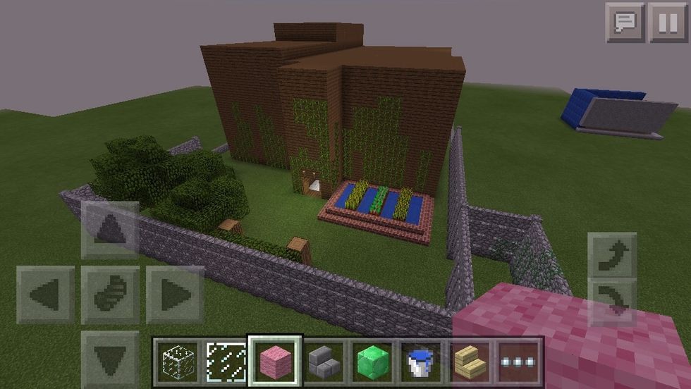 The next house is this gigantic house made of jungle wooden planks I really like the garden with all the crops...it gives that little farm feeling