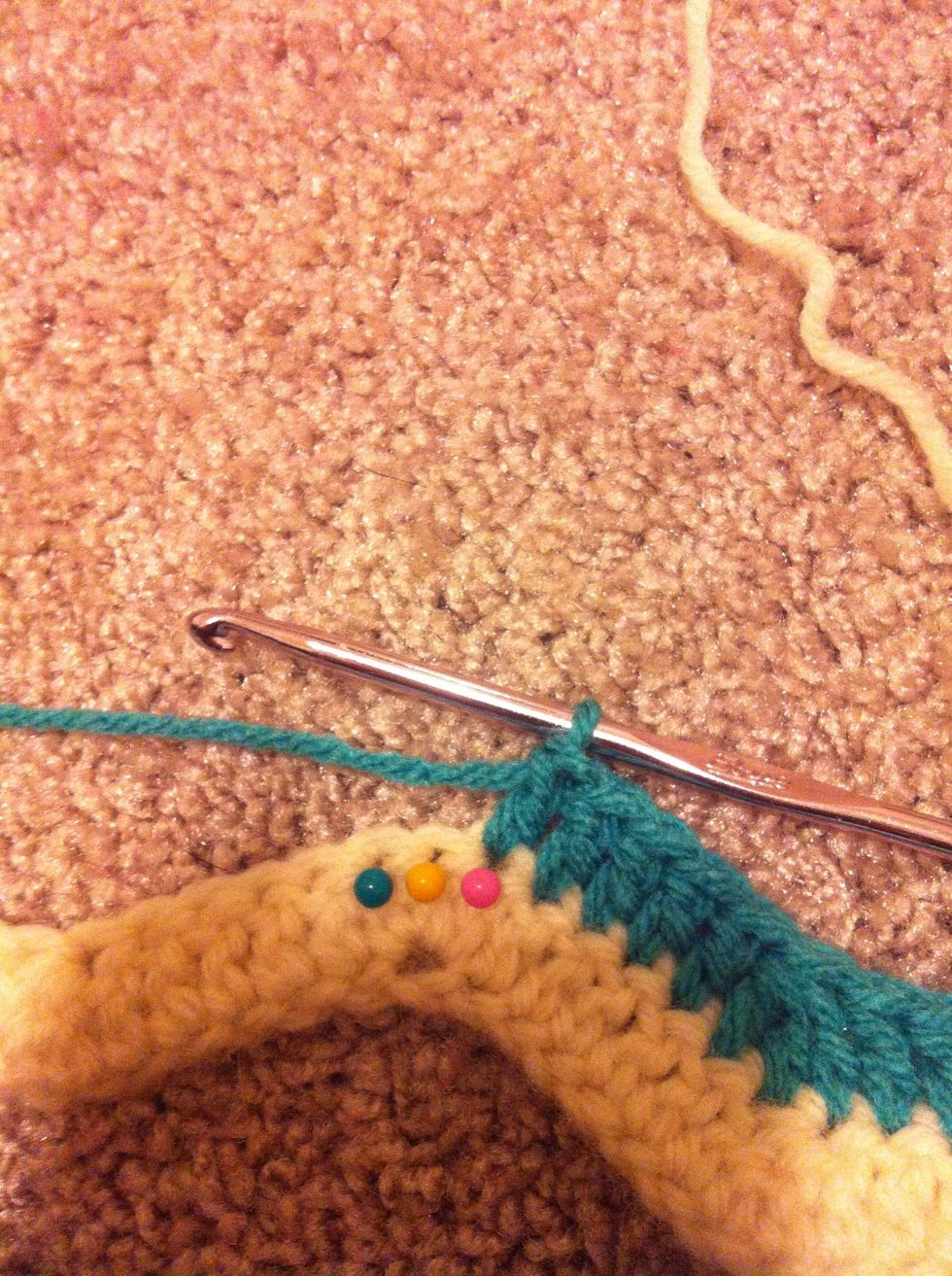 the next increase (3 double crochet shell) is worked in the middle double crochet of the previous row (yellow)