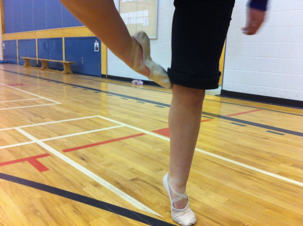 The next key point is to make sure your knee is really high up and your right foot is touching your left knee. This will also help you to keep control of your spin.