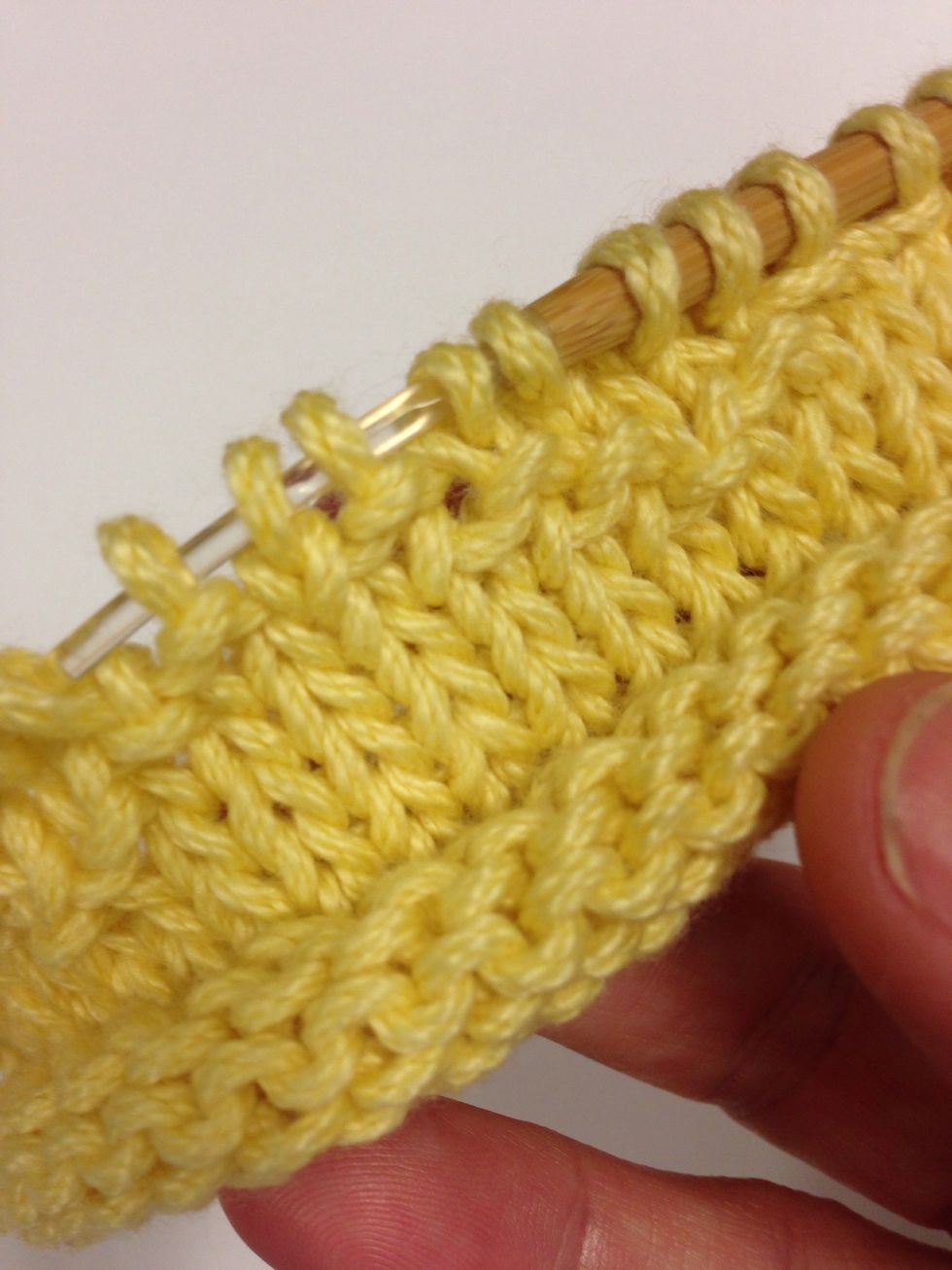 The next row, pearl every 7th and 1st stitch. Then, every 6th and 2nd stitch. Then, every 5th and 3rd stitch. They will begin to form a "v" pattern.