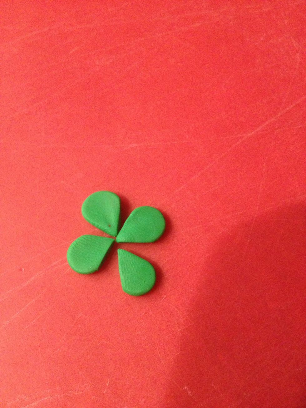 The next step can be done with a roller or a clay machine, just make sure they are all rolled to the same thickness. I used #6. Then cut the tips to a point.