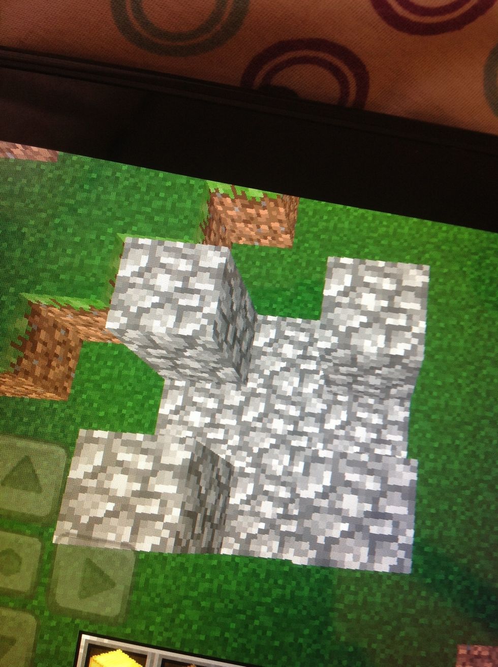 The next step is to fill in the holes between the gold with cobblestone and place one cobblestone on top of every gold.