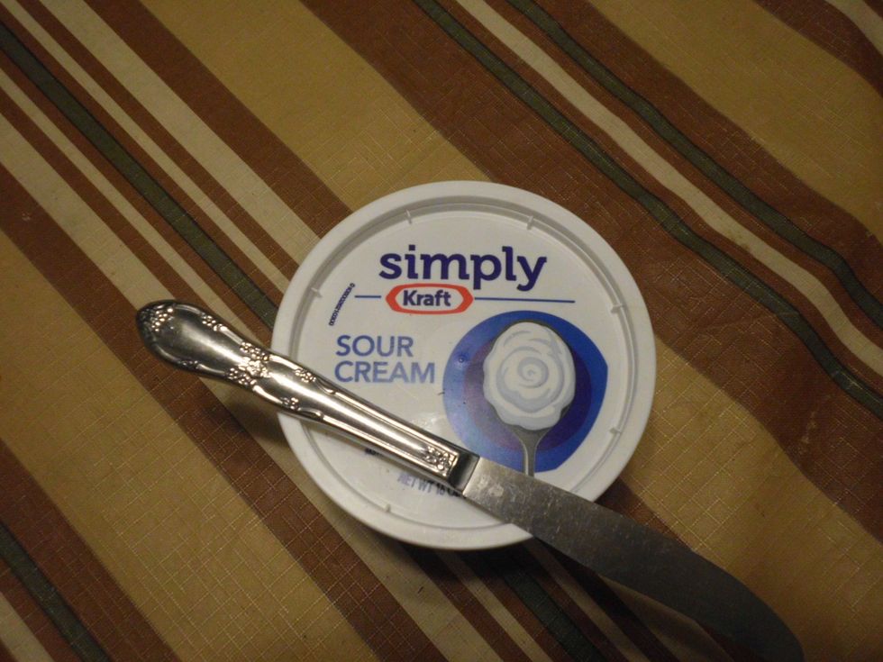 The next step is to take out the sour cream, and then the cheese cake too.