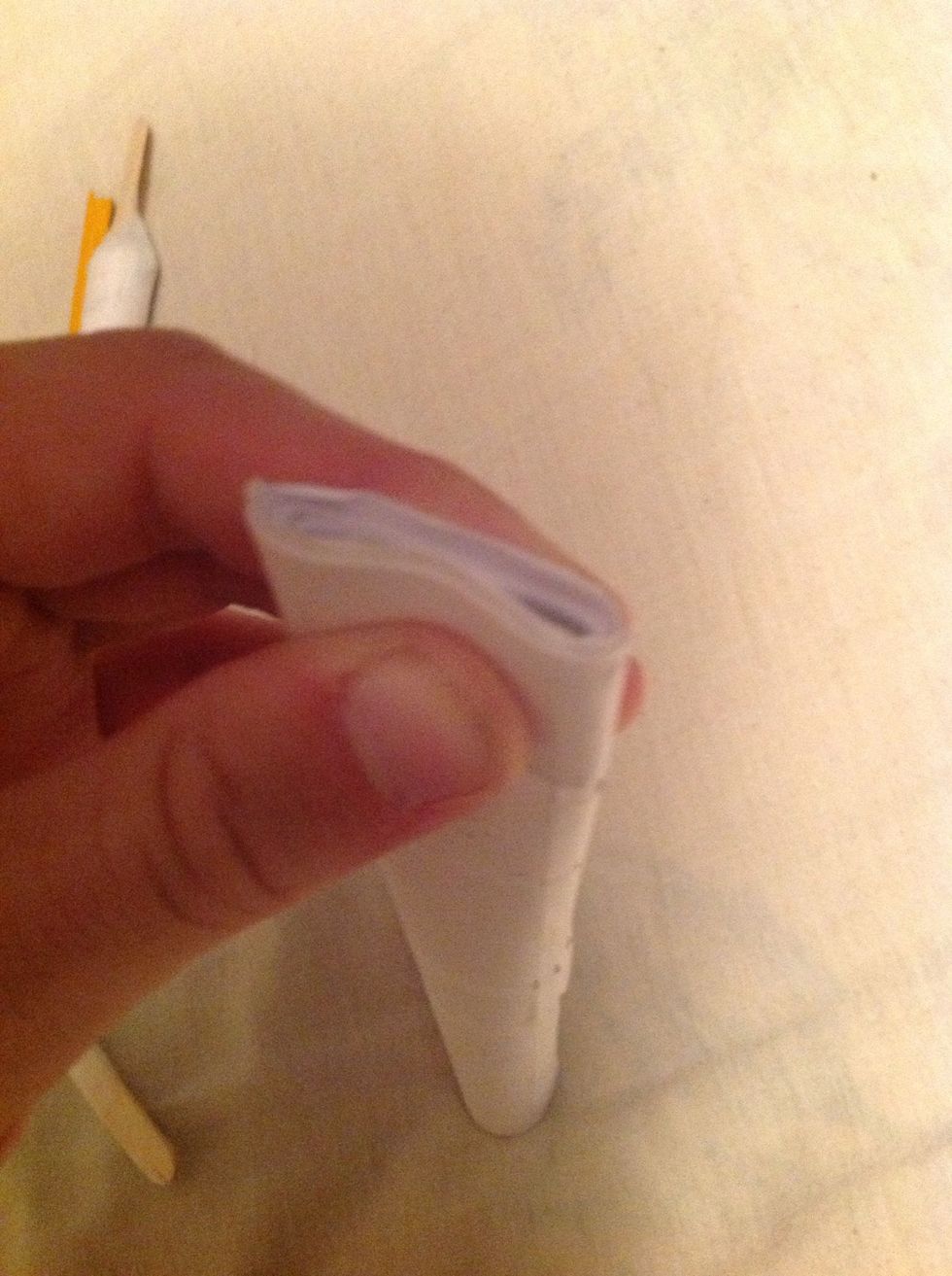 The next thing you will be doing is attaching your bow arms so you got to pinch down the one end of the main body tube.