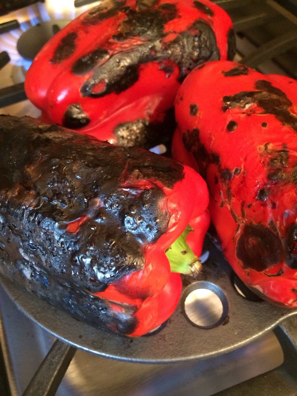 The one in the front left is done. The burnt pepper skins will be removed later to expose the delicious roasted pepper taste.