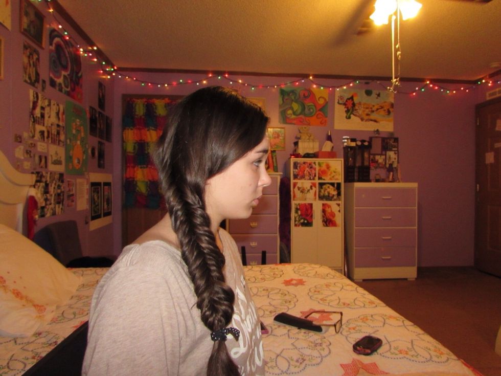 The only difference between a normal fishtail braid and an inverse is that instead of taking the strands out from behind, you take the strands from the front and cross them behind.