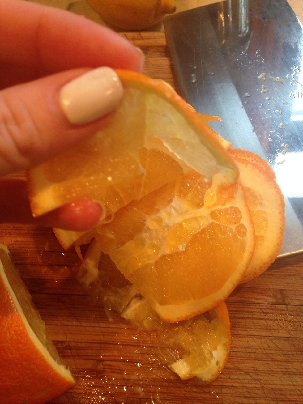 The orange slices should be cut thinly, but not necessarily beautifully. They will break down when they cook.