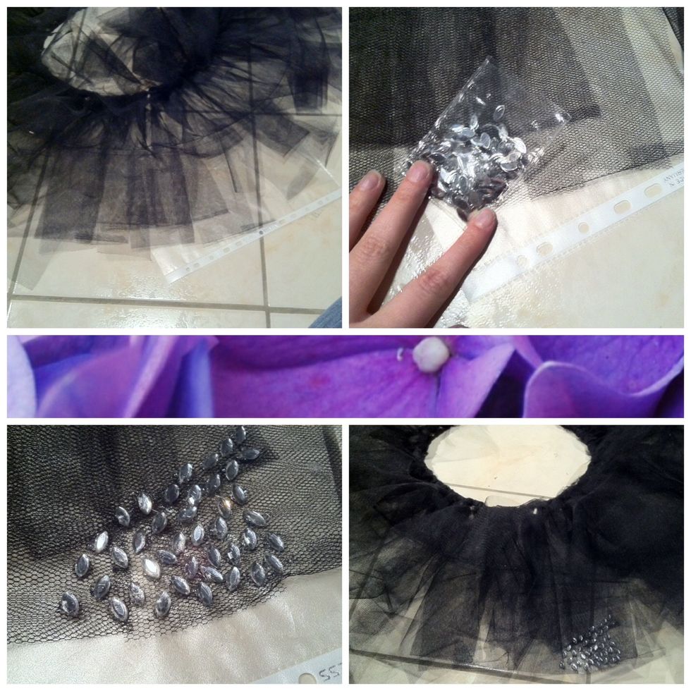 The original costume has a few rhinestones on the front of the tutu. So I glued some on the lower layer. I put another plastic sleeve underneath so that the floor stays clean.