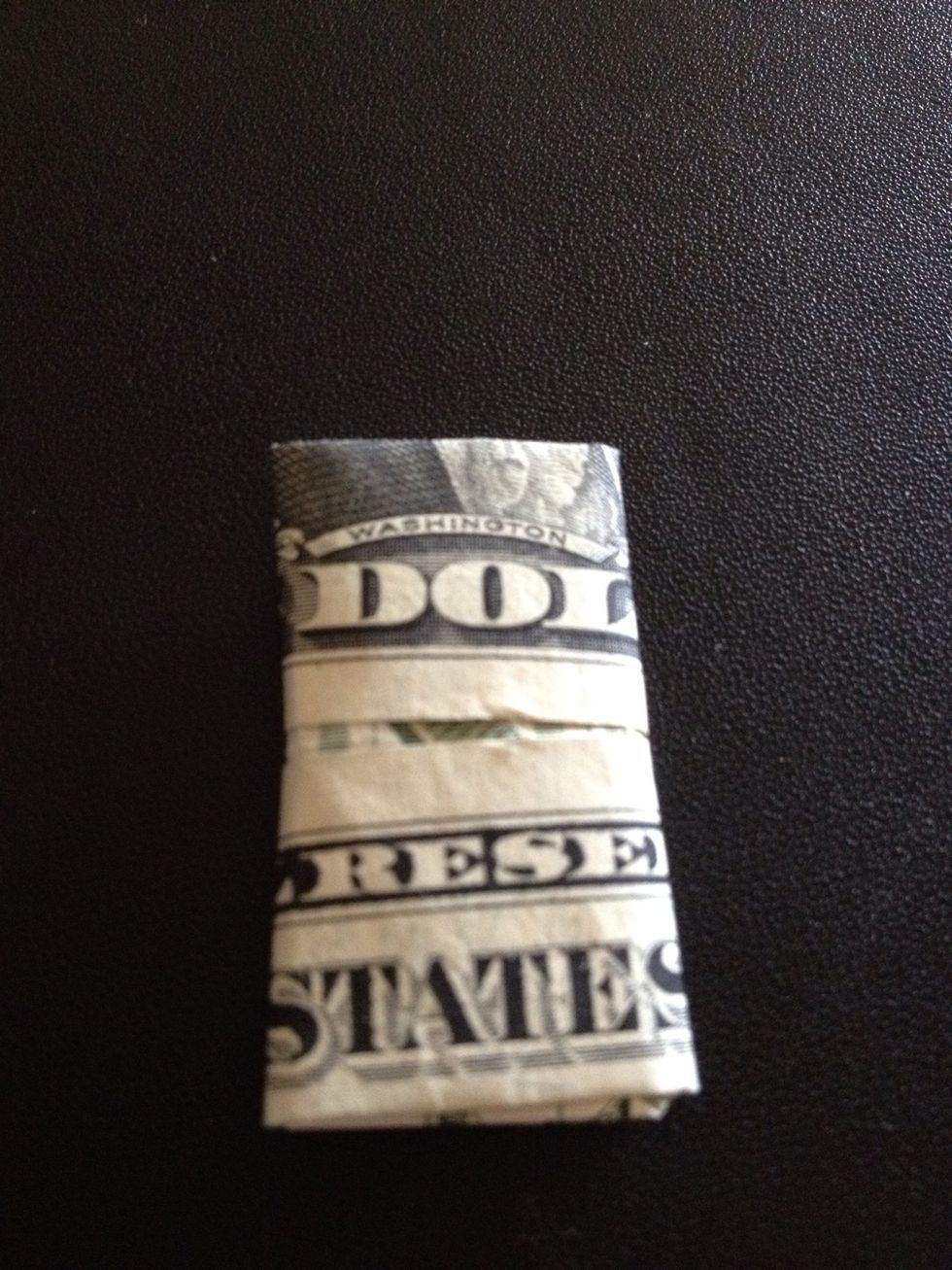 The other side of the bill after finishing.  Hand it over to a friend and ask them to unfold it without tearing it apart. I had my first folded bill in my wallet for 10 years. It brought me luck :-)