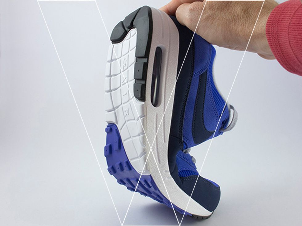 The outsole and PU midsole of Nike Air Max 1's are made from a lightweight material that is highly flexible. Demonstrated by bending the shoe without much force.