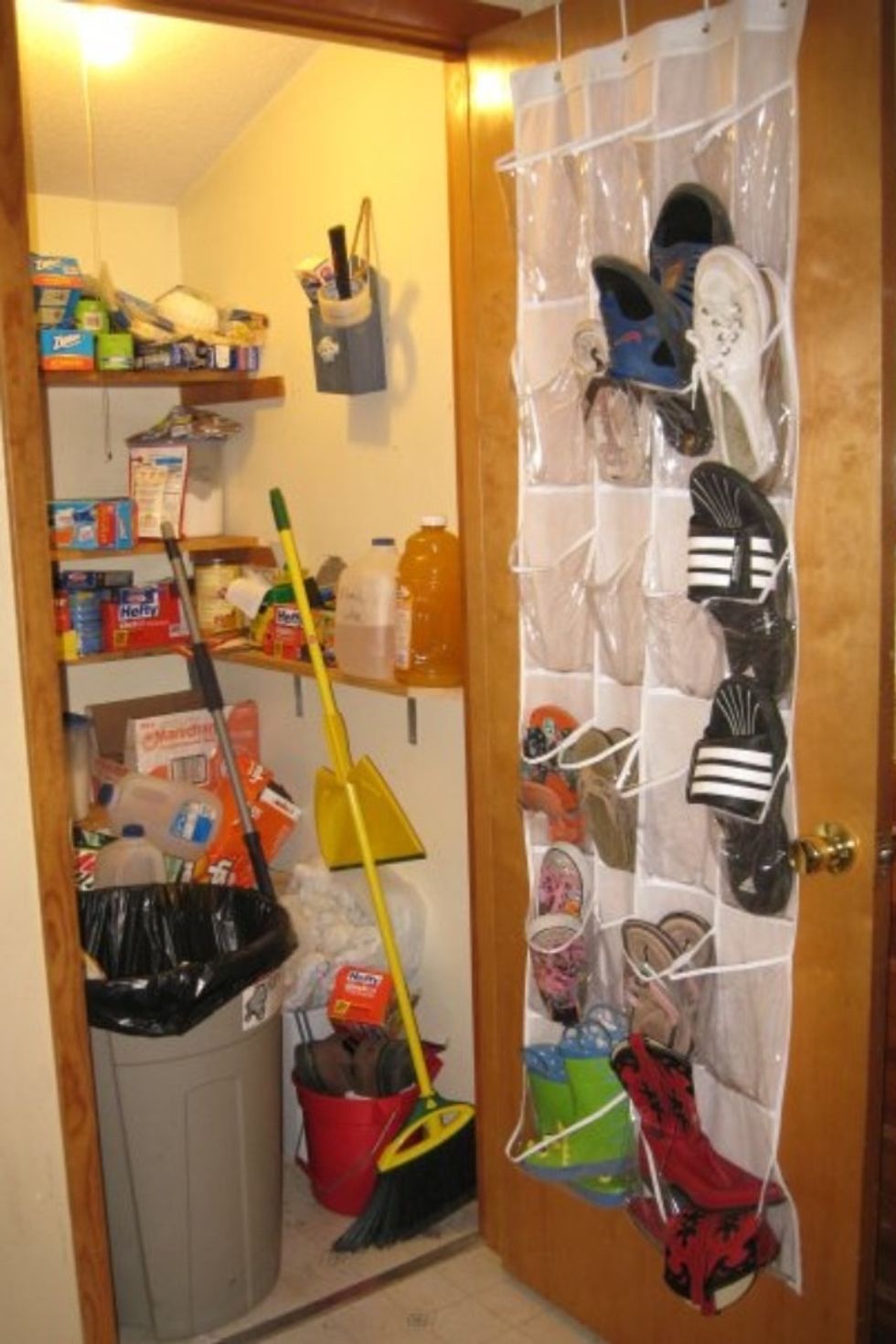 The pantry holds shoes, trash, recycling, mop, broom, canned food, bags, and anything else that we think fits.