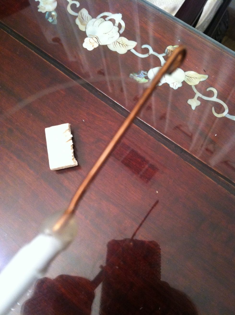 The part that you just straightened will function as the hook of the hanger connecting the fishing line to the lever arm