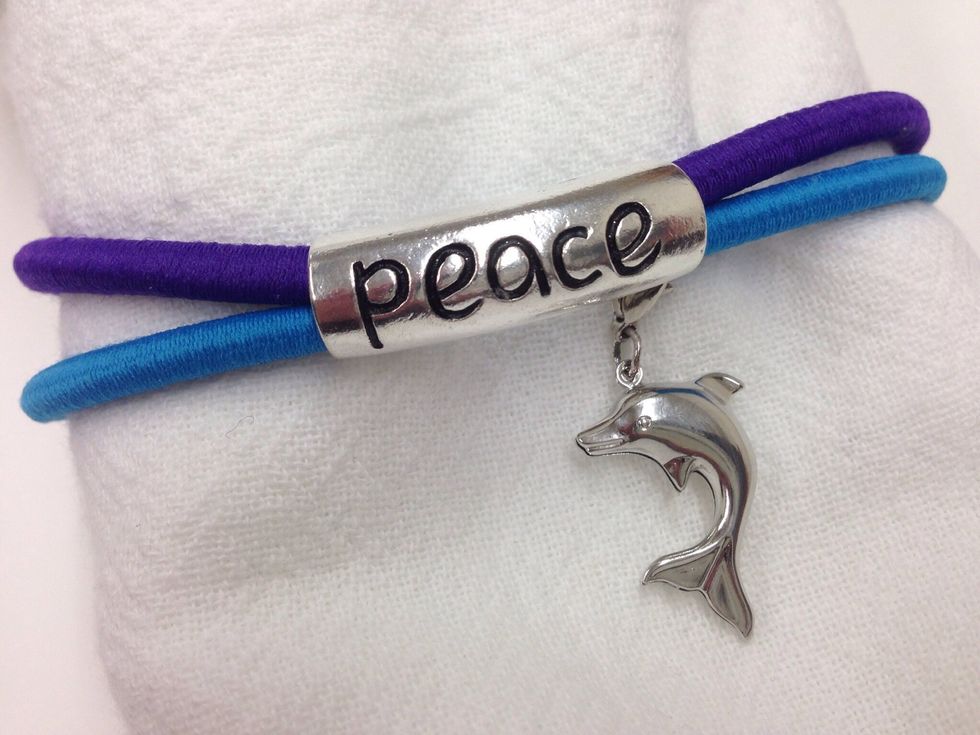 The Peace bracelet is a little more complicated than the pink bracelet...but has lots of room for customization! The interchangeable charm adds a little whimsy to the project.