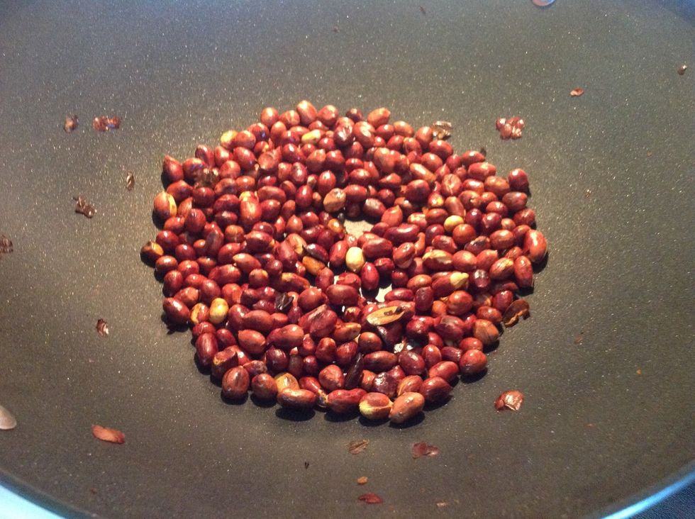 The peanuts should turn brown when they are done