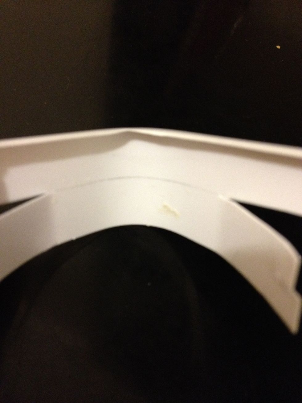 The pencil line marks the thickness of the iPhone (the upper half). The lens will sit under that line. Split the two ends of the holder but leave the corner intact.