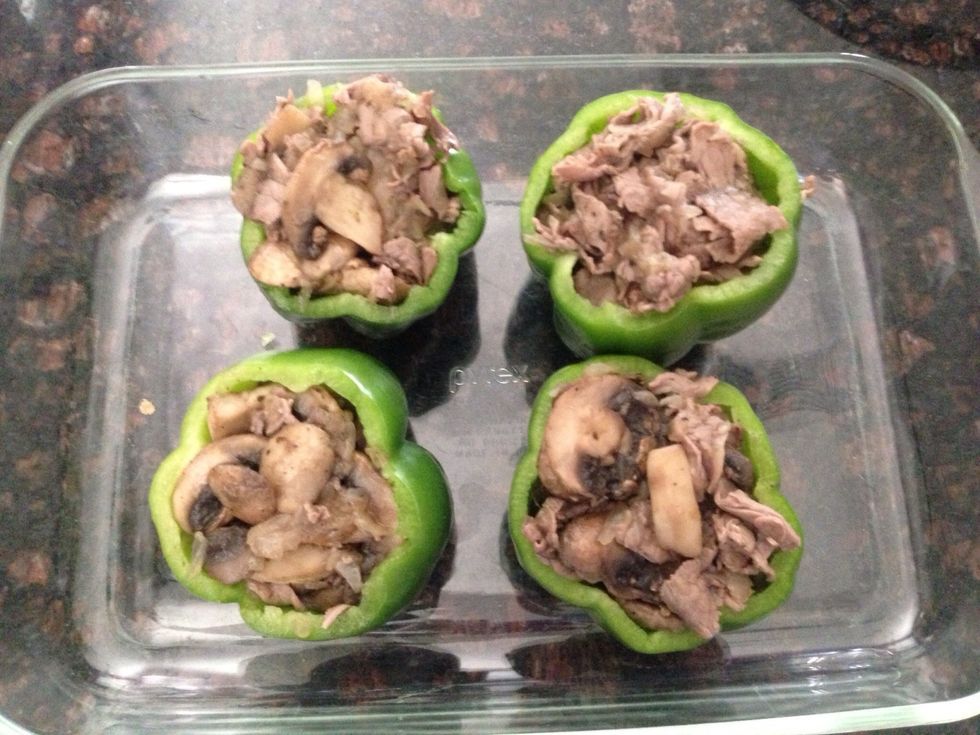 The peppers are Filled to the brim and ready for the topping.