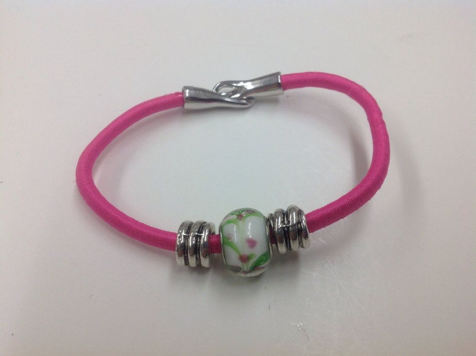 The pink beaded bracelet is the easiest bungee cord project in this collection.