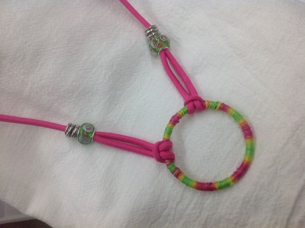 The pink necklace is a fun companion to the pink bracelet. It's not hard to make, but wrapping the central ring takes a little time. It's worth the effort for a unique focal point, though!